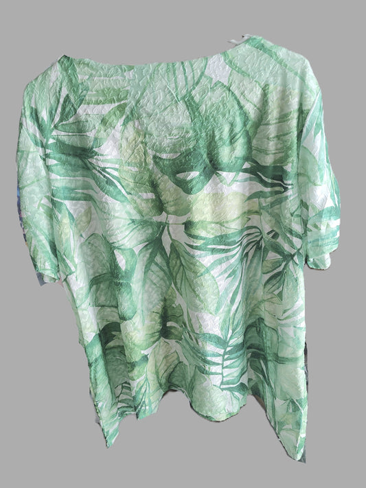 Green leaf-patterned shirt on a gray background