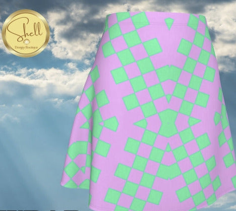 Pink and green checkered wrap skirt with 'Shell' brand logo against a cloudy sky background.