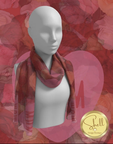 Mannequin wearing a colorful scarf with a red floral background, featuring the Shell Design logo.