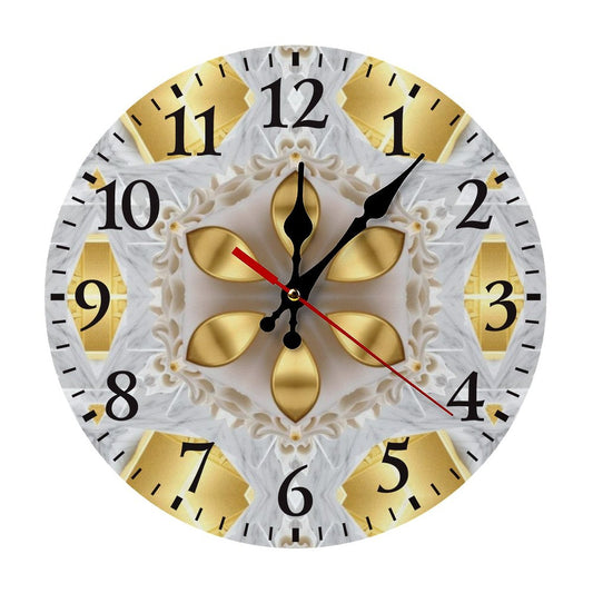 Decorative wall clock with gold and black design on a white background
