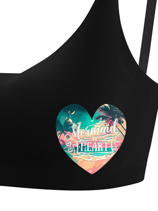 Black sports bra with a colorful 'Mermaid at Heart' design on a white background