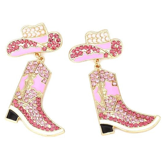 Pink cowboy boot earrings with rhinestone embellishments on a white background