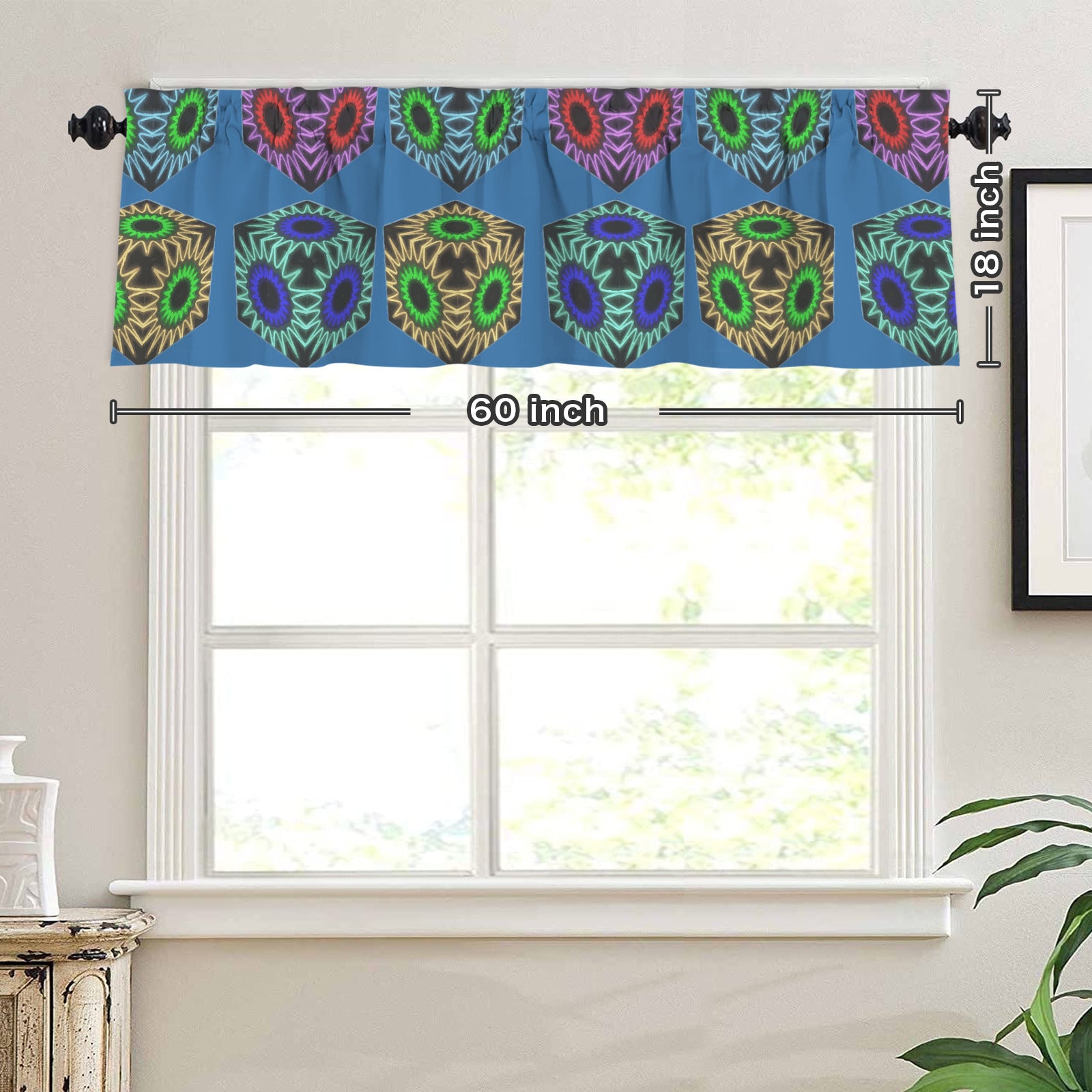 Decorative curtain valance with peacock feather pattern on a window