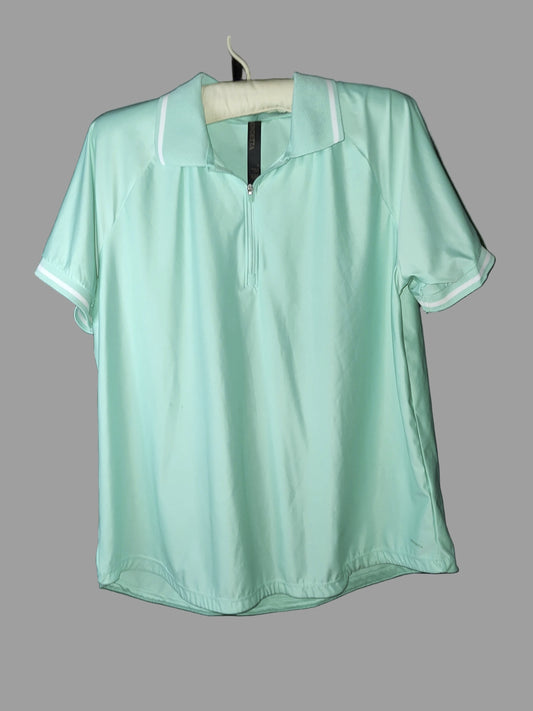 Light green shirt on a grey background
