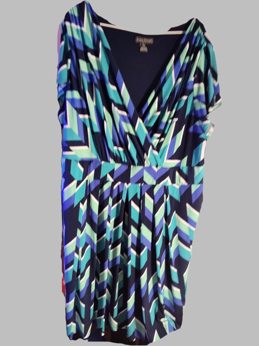 Colorful geometric patterned dress on a white background