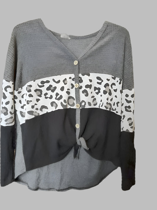 Gray cardigan with leopard print accents on a gray background