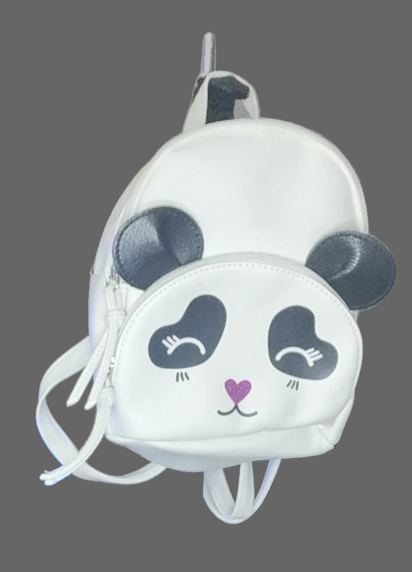 Panda-shaped white bag with black accents hanging on a hook.