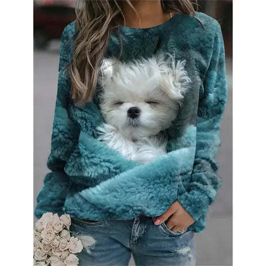 Teal fleece pullover with a dog design worn by a person, holding flowers.