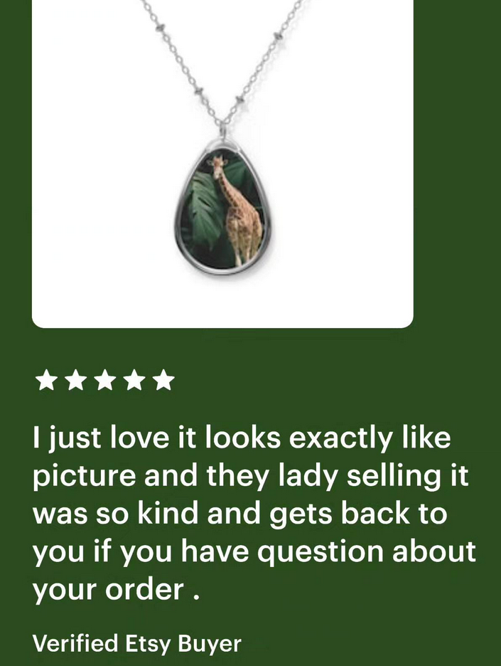 Tall Giraffe Surrounded by Greenery Oval Necklace