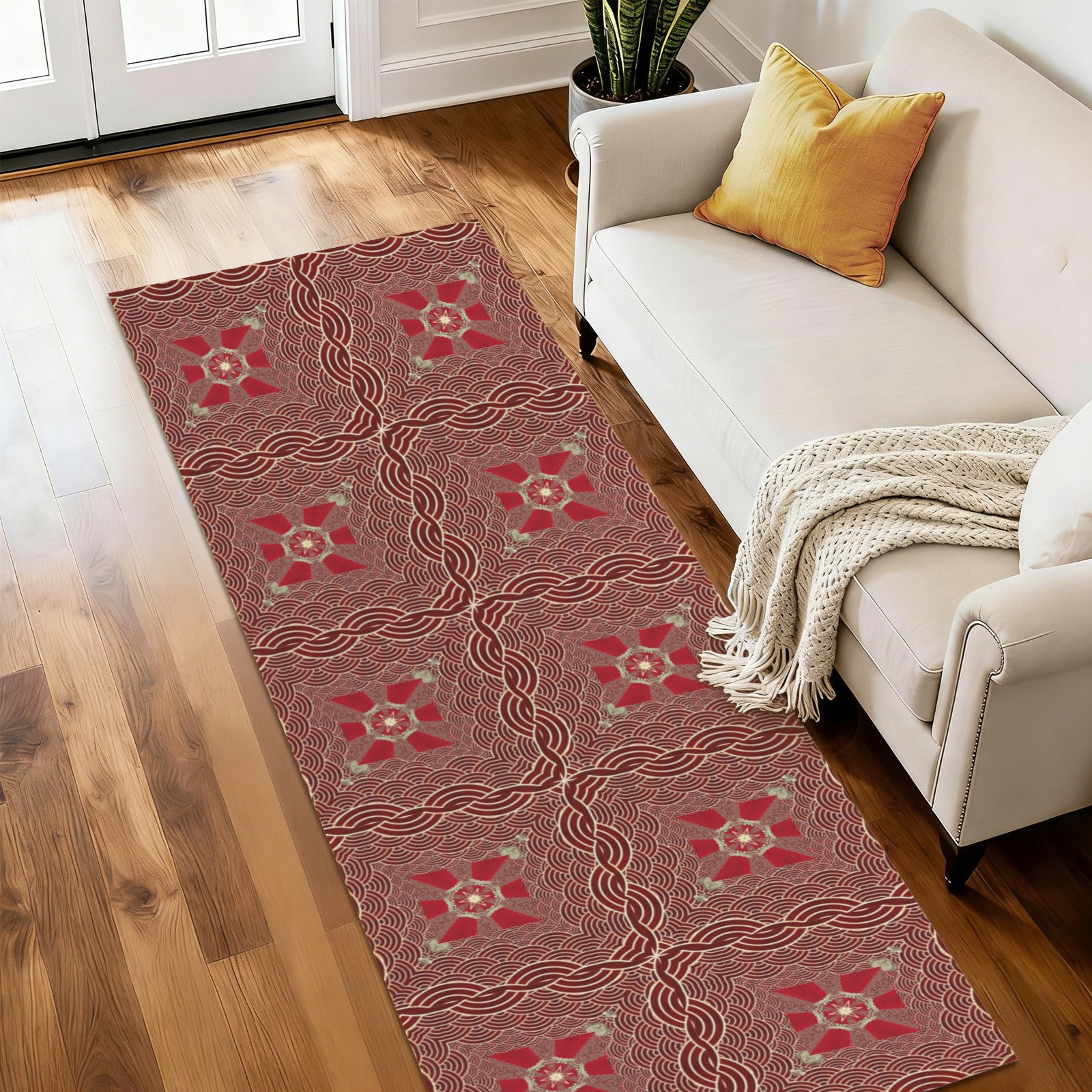 Patterned rug on a wooden floor in a living room with a white sofa and yellow pillow.