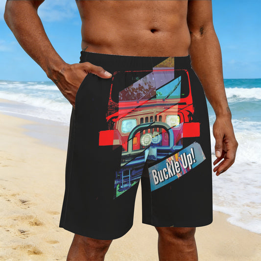 Person wearing black shorts with a colorful suv graphic on a beach.