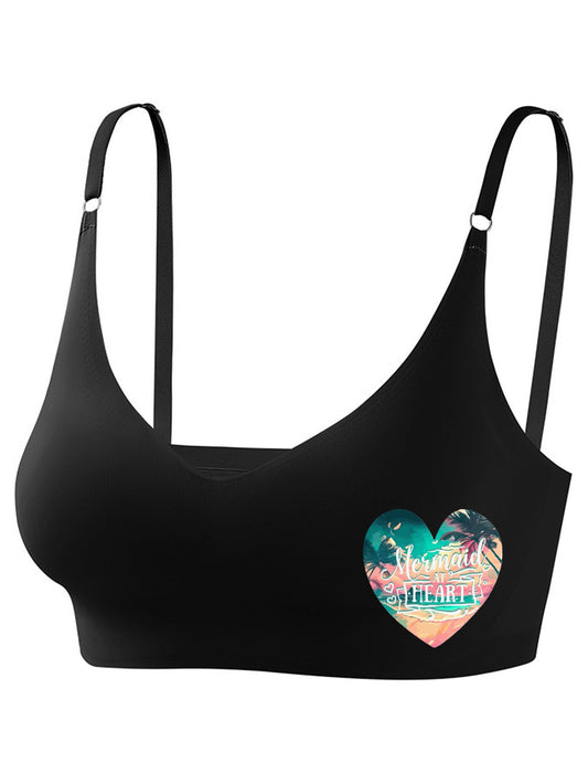 Black sports bra with a colorful heart design on a white background